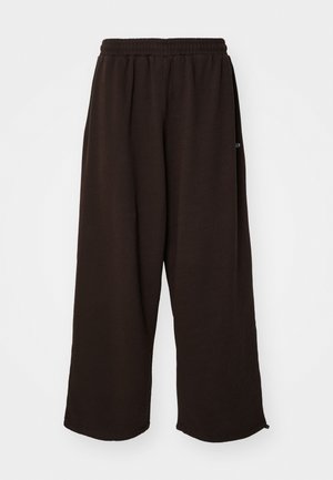 Brown wide-leg pants made from soft fabric, featuring an elastic waistband and a casual design, suitable for relaxed wear.