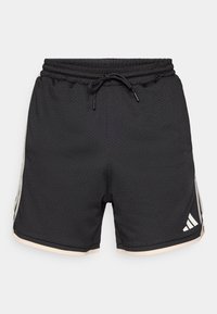 Black athletic shorts made of breathable mesh material, featuring a drawstring waistband and light beige accents on the hem and sides.