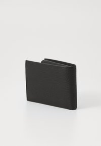 Black leather wallet with a textured surface, compact rectangular shape, and folded design, showcasing a sleek and minimal aesthetic.