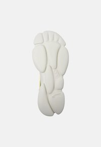 Shoe sole featuring a chunky, textured white design with rounded shapes and grooves; embossed size "36" visible.