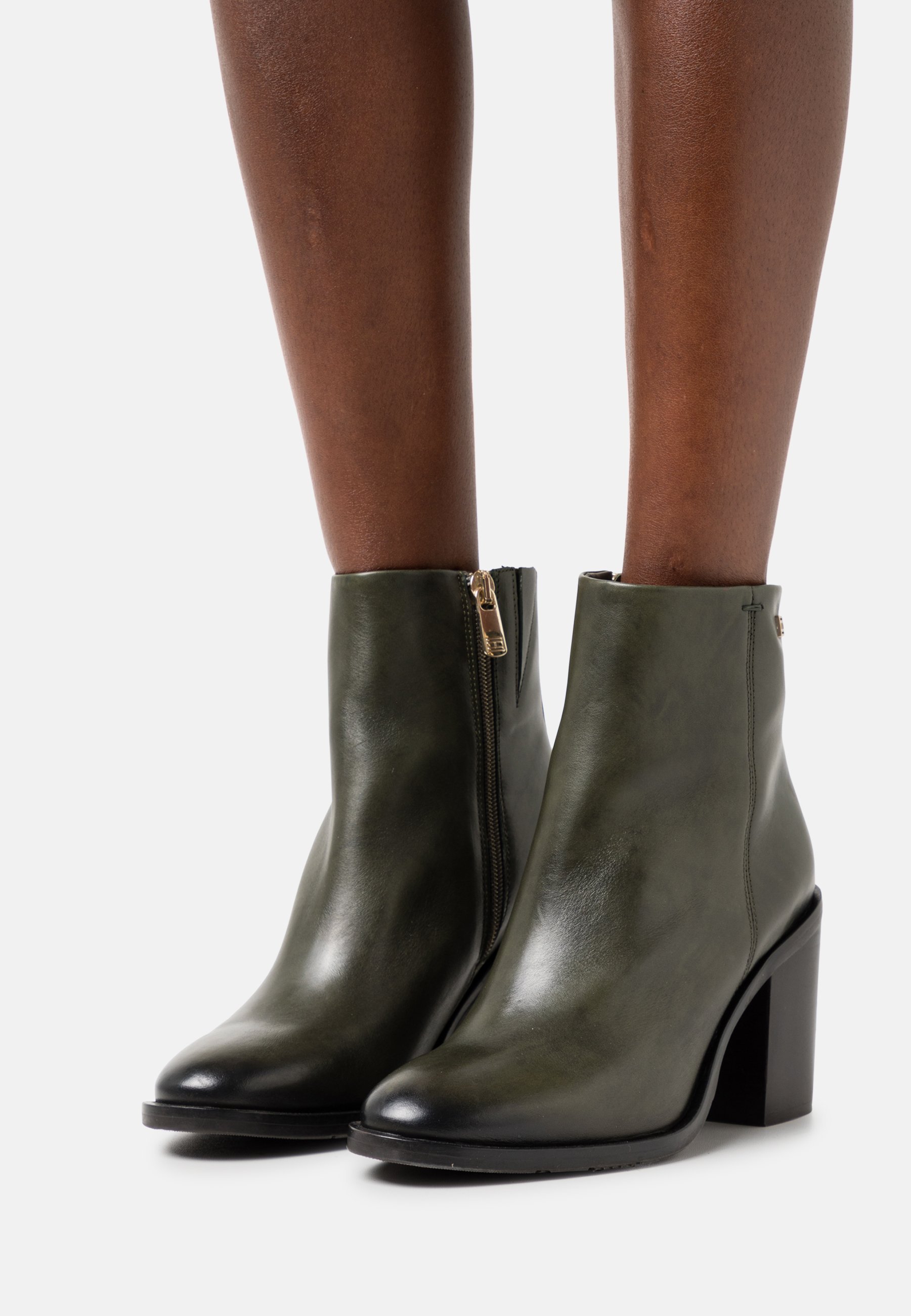 brown and black tommy hilfiger boots