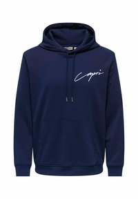 Marineblaue Kapuzenjacke aus weichem Stoff, mit einer Fronttasche, gerippten Bündchen und einer Kordelzugkapuze. Weißer "Capri"-Text auf der Brust.