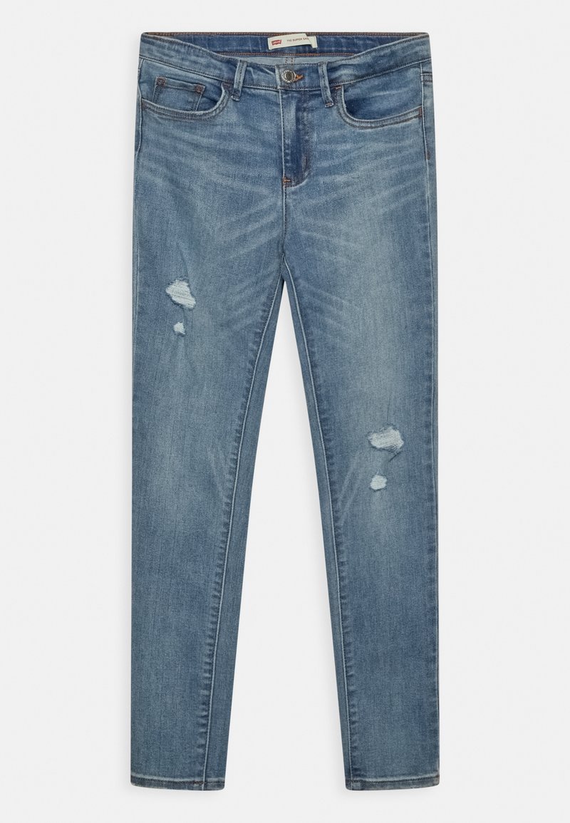 Jean en denim bleu clair avec une coupe slim. Présente des zones usées et des coutures visibles. Design classique à cinq poches avec une fermeture à bouton.