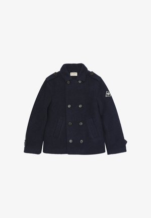 Cappotto peacoat in lana blu navy con chiusura a doppio petto, spalline e tasche laterali. Presenta una patch con logo sulla manica sinistra.