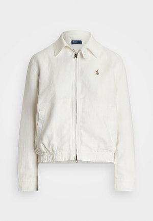 White linen jacket with a collared neck, front zip closure, elastic waistband, and a small embroidered logo on the left chest pocket.