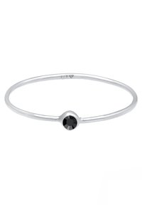Bracelet en argent avec une pierre noire ronde au centre. Le bandeau est lisse et fin, avec une finition polie. Marqué "925" à l'intérieur.
