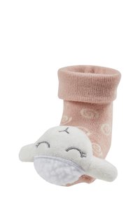 Pink sock with a rolled cuff, featuring a white plush animal with stitched facial details. Made from soft fabric with a textured finish.