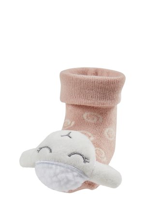 Pink sock with a rolled cuff, featuring a white plush animal with stitched facial details. Made from soft fabric with a textured finish.