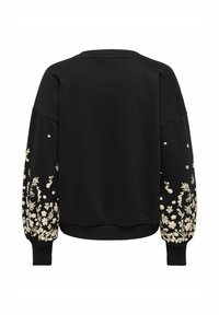 Črn pulover z dolgimi rokavi s kompleksno bež cvetlično vezenino ob mansetah in rebrastim robom. Mehka tkanina.