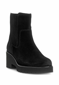 Schwarze Ankle Boots aus Wildleder mit einem kräftigen Plateausohle, elastischen Seiteneinsätzen und einer glatten Textur. Geschlossene Zehenform mit einfacher Naht.