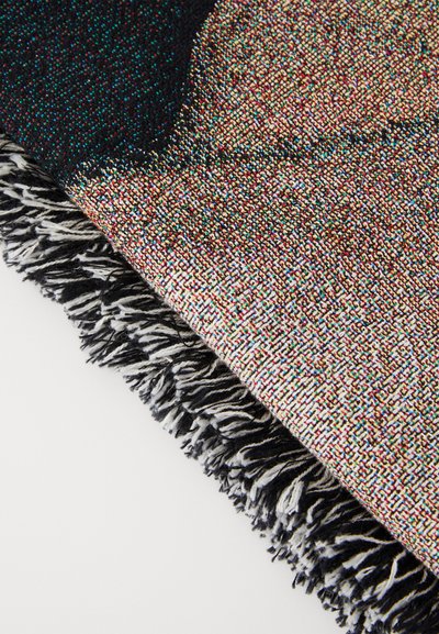 Colorful woven blanket featuring a vibrant multi-hued pattern, black accents, and a fringed edge in black and white. Soft texture.