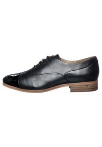 Chaussure en cuir noir avec un bout en cuir verni brillant, surface lisse, forme arrondie et petit talon empilé. Design minimaliste avec lacets.