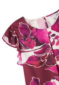 Top floreale con maniche corte e volant; presenta audaci motivi floreali rosa e viola su uno sfondo bianco e bordeaux; tessuto morbido.