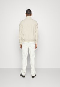 Tommy Jeans Tunn jacka - sand