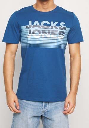 Blue cotton t-shirt featuring a horizontal stripe design in light blue, white, and gray. Large "JACK & JONES" text across the chest.