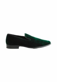 Velvet slip-on shoe in dark green with a smooth texture, rounded toe, and low black rubber sole. No visible hardware or patterns.