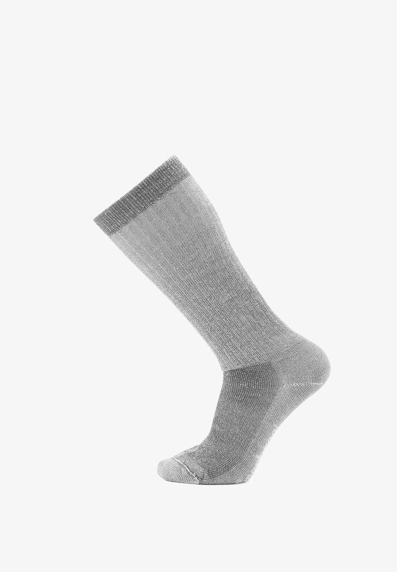 Calzino grigio con una maglia texturizzata, bordo a costine, punta e tallone rinforzati. Caratterizzato da una finitura liscia e un design di lunghezza media fino al polpaccio.
