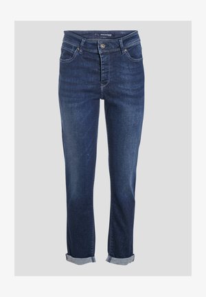 Granatowe dżinsy z prostą nogawką, pięcioma kieszeniami i mankietami. Posiadają zamek błyskawiczny oraz metalowy guzik do zapięcia.