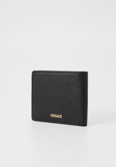 Black leather wallet with a textured finish, featuring a gold logo on the front and a rectangular shape with stitched edges.