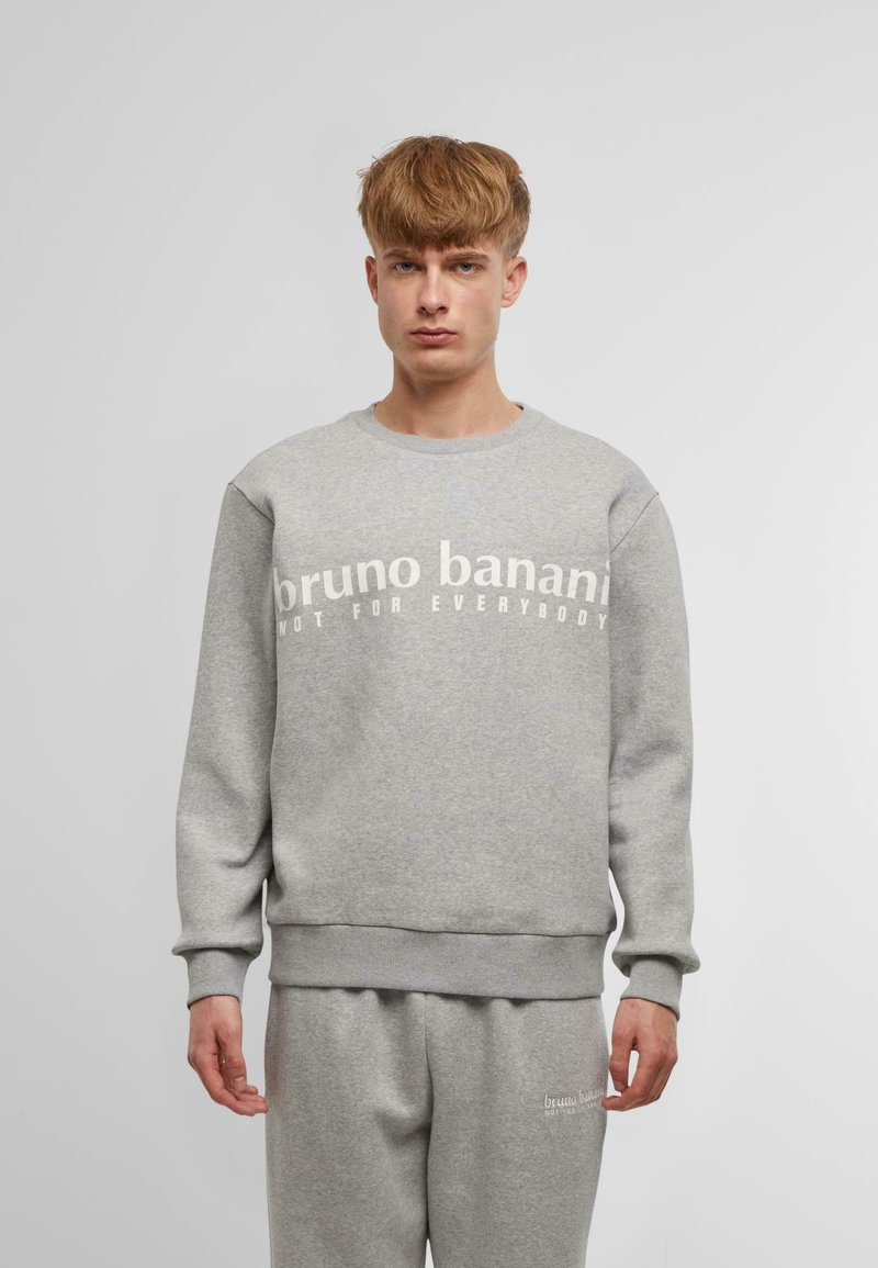 Gray sweatshirt with a crew neck and ribbed cuffs. Features white text “bruno banani NOT FOR EVERYBODY” across the chest. Soft, textured fabric.