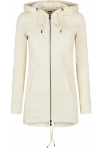 Ljusbeige zip-up hoodie med fodrad huva, dragsko, två framfickor och ribbade mudd. Slät tyg med en avslappnad passform.