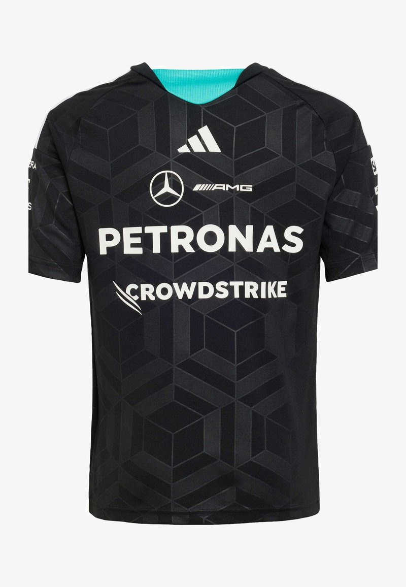 Maglia atletica nera con motivo geometrico, dettaglio turchese al collo, con marchi bianchi: "PETRONAS" e "CROWDSTRIKE".