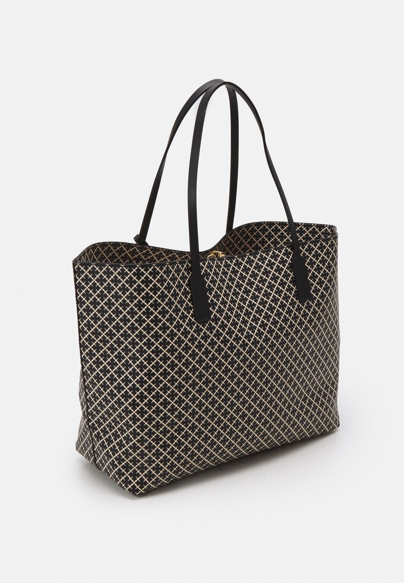 Black tote bag with a geometric cream pattern, made of fabric, featuring dual black handles and a structured shape.