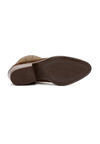 Brown suede boot lying on its side showing a textured sole with a block heel on a white background.