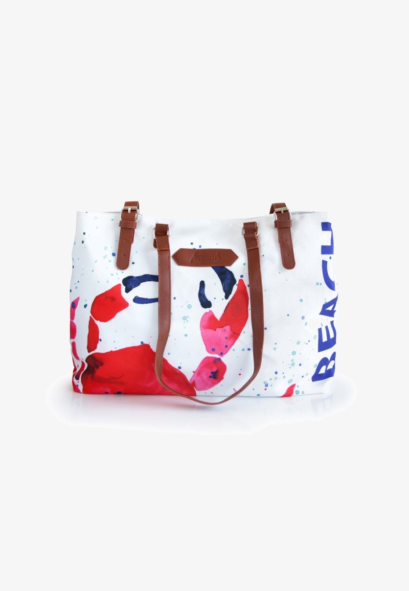Canvas tote bag featuring a vibrant crab design in red, pink, and blue, with brown leather straps and the word "BEACH" printed in blue.