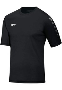 Black short-sleeve T-shirt made of smooth fabric. Features white "JAKO" branding on the front and three dot accents on the left sleeve.