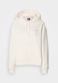 Felpa color crema realizzata in tessuto morbido, con una tasca a marsupio, cappuccio con stringhe e logo frontale in testo rosa. Polsini e orlo a coste.