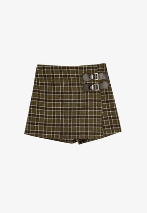Brune og grøn ternede shorts med dobbelte spændeakkenter på siden. Lavet af tekstureret stof med en struktureret form.