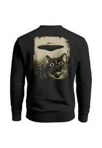 Black sweatshirt featuring a graphic of a cat with large eyes and an open mouth, set against a backdrop with a UFO and grass.
