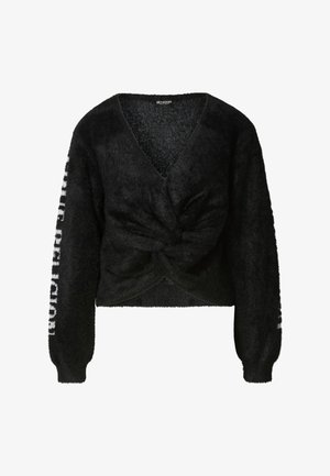 Fekete, bolyhos pulóver mély V-nyakkivágással és elől csavart dizájnnal. A hosszú ujjakon az egyik oldalon a "PUBLIC RELIGION" felirat olvasható.