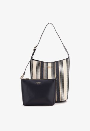 Gestreifte Stofftasche in Creme und Schwarz mit einem abnehmbaren schwarzen Beutel, der einen Reißverschluss und goldene Logoakzente aufweist.