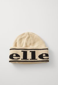 Strikket lue i beige med et kraftig svart logobånd. Designet har en avrundet topp og ribbestruktur for ekstra varme.