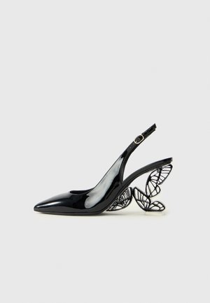 Black patent leather slingback pump with pointed toe, featuring an intricate butterfly wing heel design in contrasting material.