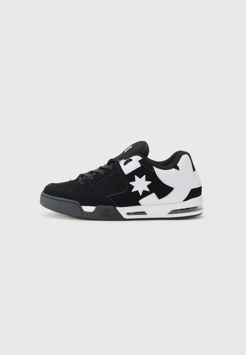 Black and white sneaker with suede and mesh materials. Features a prominent star logo and bold accents on the side, with a cushioned sole.