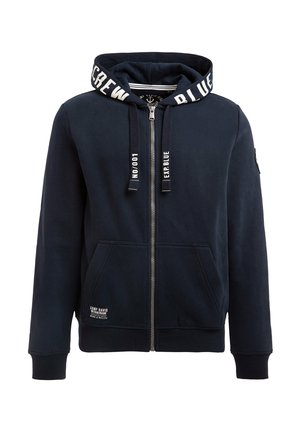 Haut à capuche zippé pour homme en coton mélangé, présentant une capuche à cordon de serrage, des poignets côtelés, deux poches avant, et des détails de logo contrastés.