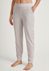 Lichte katoenen pyjamabroek met een witte achtergrond en een marineblauw golfpatroon, voorzien van een comfortabele elastische tailleband en zijzakken.