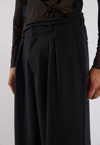 YOURTURN UNISEX - Tygbyxor - black