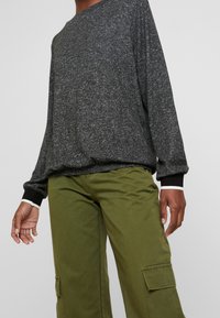 s.Oliver Strickpullover - mottled black