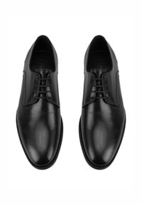 Schwarze Lederhalbschuhe mit glatter Textur, runder Spitze und fünf Ösen-Lockverschluss; minimalistisches Design mit dezenten Steppnähten.