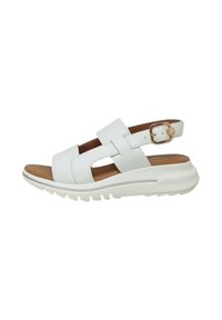 Sandalo bianco in pelle con cinturini incrociati, lati aperti e fibbia regolabile. Presenta una soletta color beige e una spessa suola in gomma bianca.