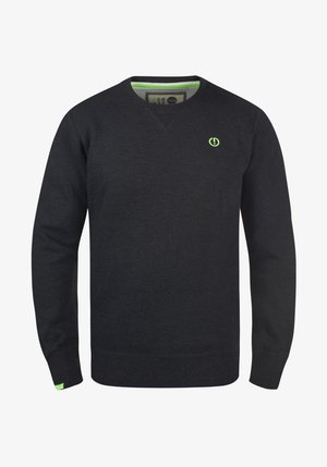 Mustaga V-kaelusega dressipluus, millel on pikad varrukad ja rohelised aktsendid. Rinnal on väike logo ja kontrastne sisemine krae. Pehme tekstuur.