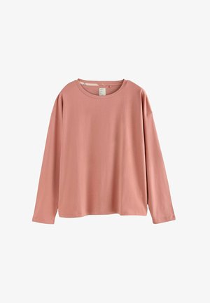 Tee-shirt à manches longues en rose poussiéreux. Encolure ronde, coupe décontractée, matériau en coton doux et texture subtile. Pas de motifs ni d'embellissements visibles.