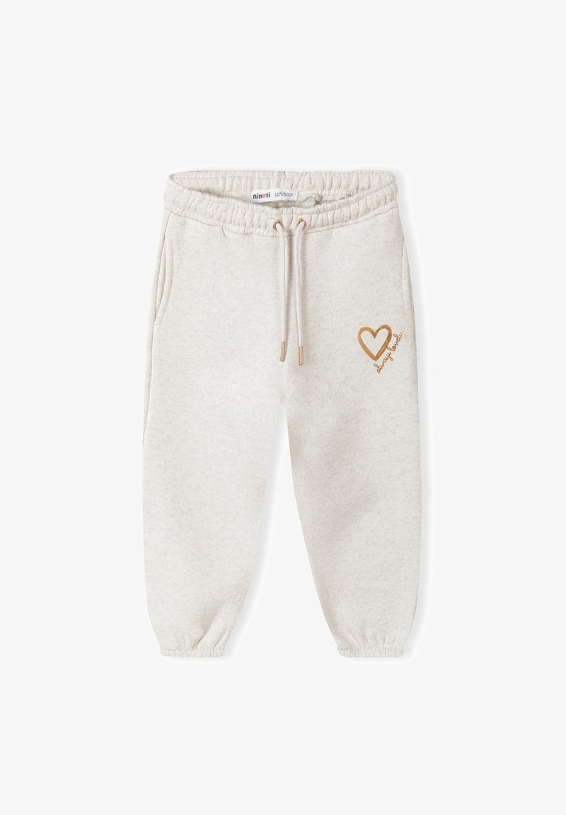 Pantalons de survêtement gris clair, doux, avec une taille élastique et un cordon de serrage. Présente un cœur doré et le texte "toujours amical" sur la cuisse gauche.