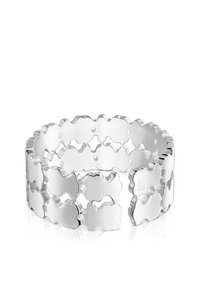 Bracelet en argent avec un design ondulé composé de formes texturées interconnectées et une finition polie, présentant des sections ouvertes et des bords lisses.