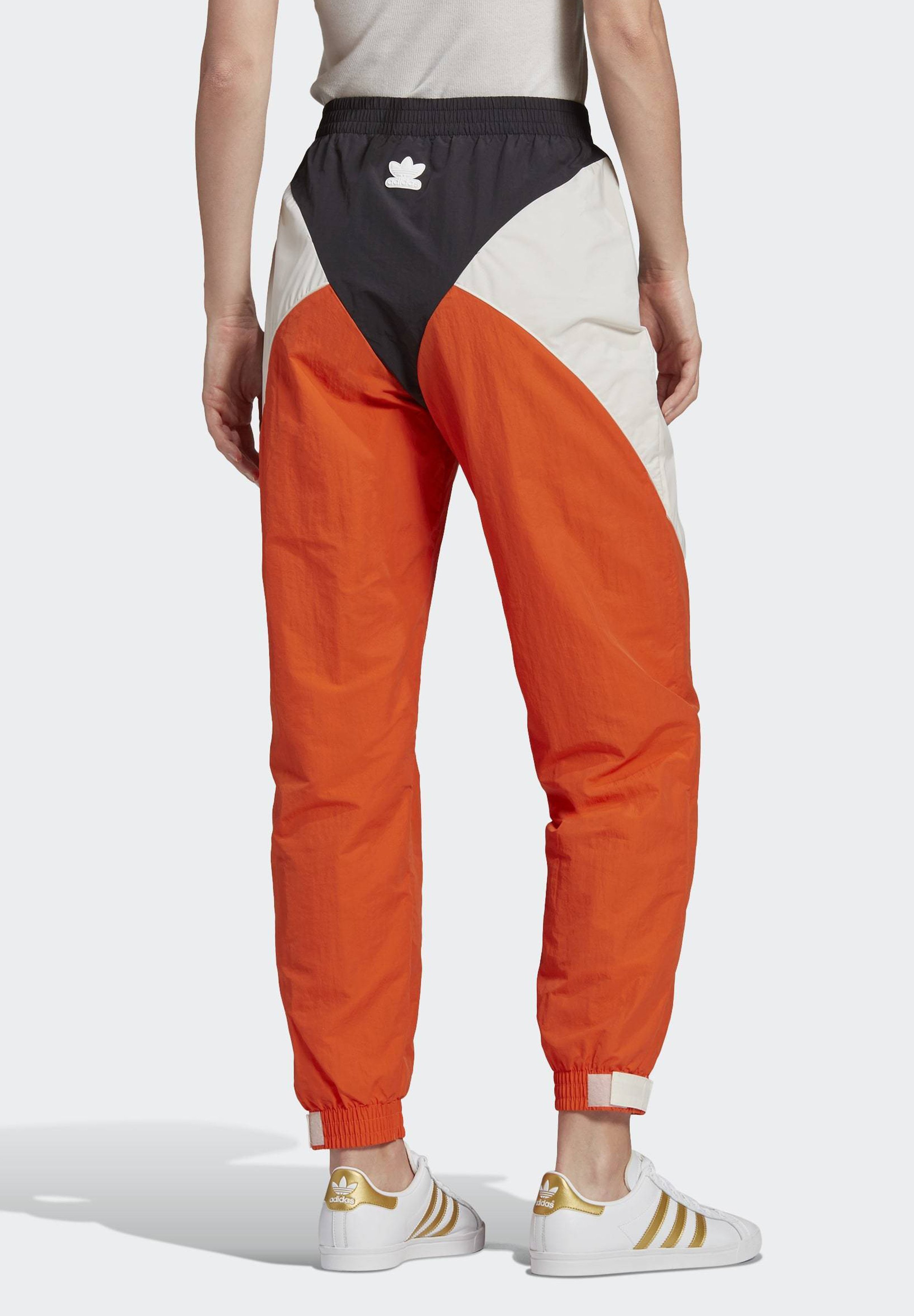 orange and white adidas tracksuit