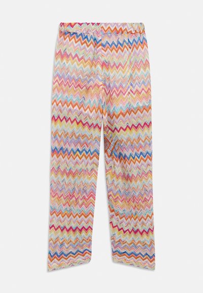 Pantalon à motifs zigzag colorés comprenant des nuances de rose, bleu, jaune et orange, avec une taille élastique et une coupe décontractée.